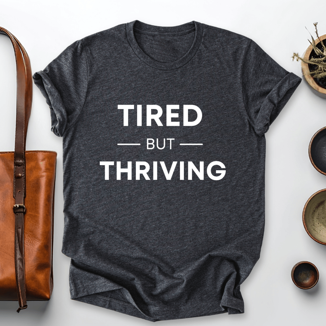 mom life tee that says Tired but Thriving Mom T-Shirt for moms